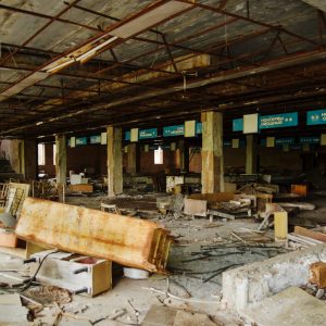 Supermarket shop at Chernobyl exclusion zone with ruins of abandoned pripyat city zone of radioactivity ghost town.